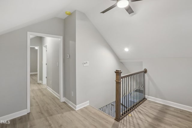 additional living space featuring light hardwood / wood-style floors, lofted ceiling, and ceiling fan