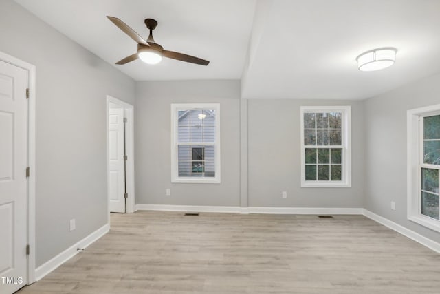 interior space featuring ceiling fan, light hardwood / wood-style floors, and plenty of natural light