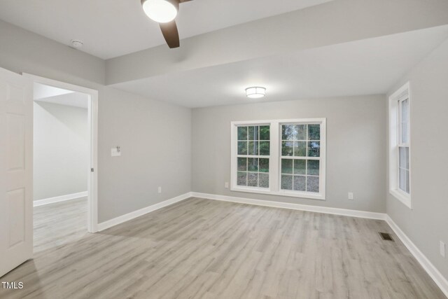 unfurnished room featuring light hardwood / wood-style flooring and ceiling fan