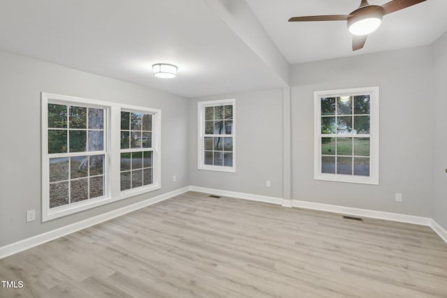 unfurnished room featuring light hardwood / wood-style floors and ceiling fan