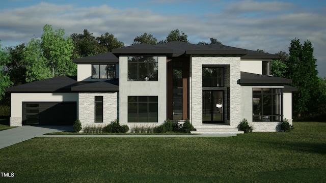 view of front facade with a front yard and a garage