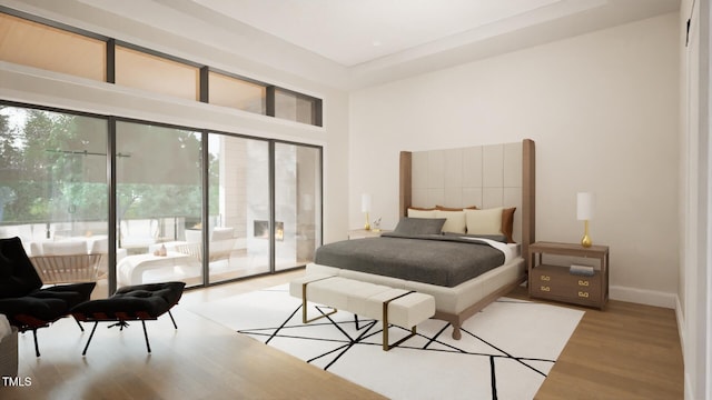 216 Dartmouth Rd, Raleigh, NC 27609 - bedroom featuring light wood-style flooring, a towering ceiling, and access to exterior