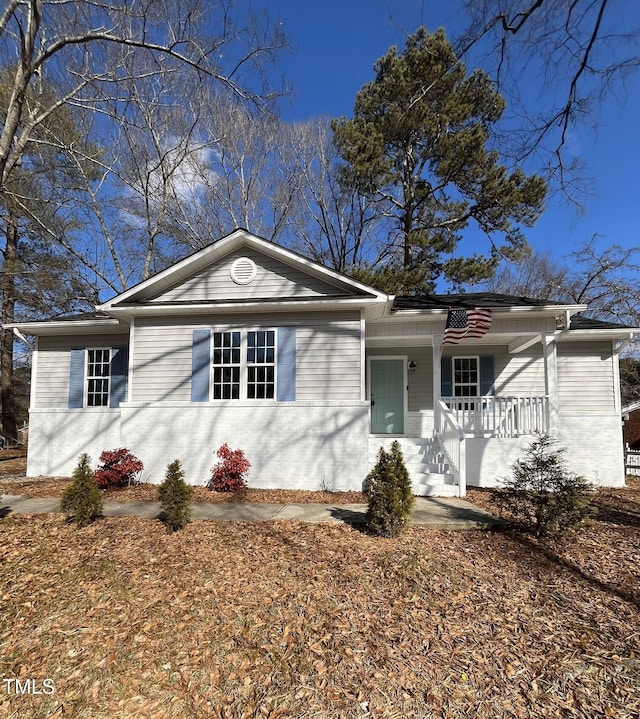 ranch-style home with covered porch