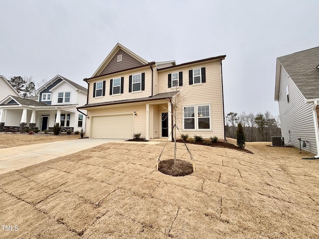 front facade with central AC unit and a garage