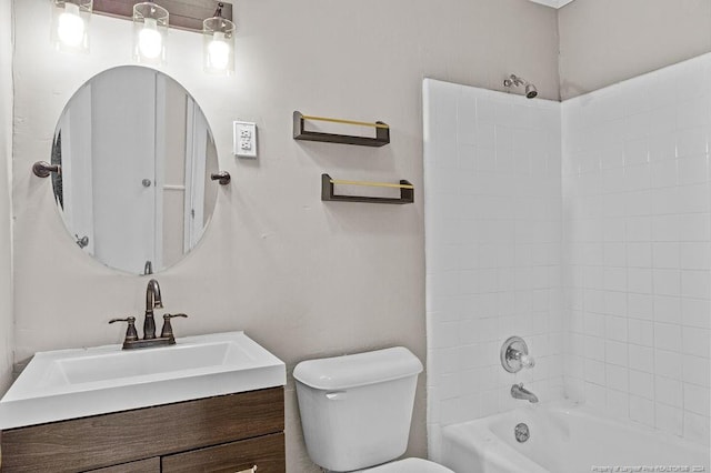 full bathroom featuring vanity, toilet, and tiled shower / bath