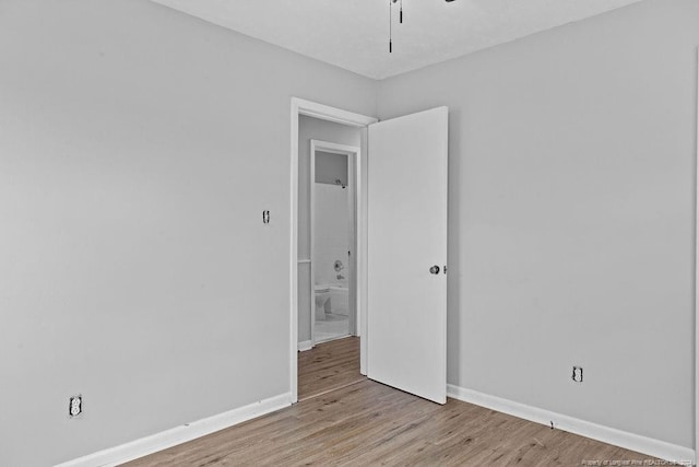 empty room with light hardwood / wood-style floors