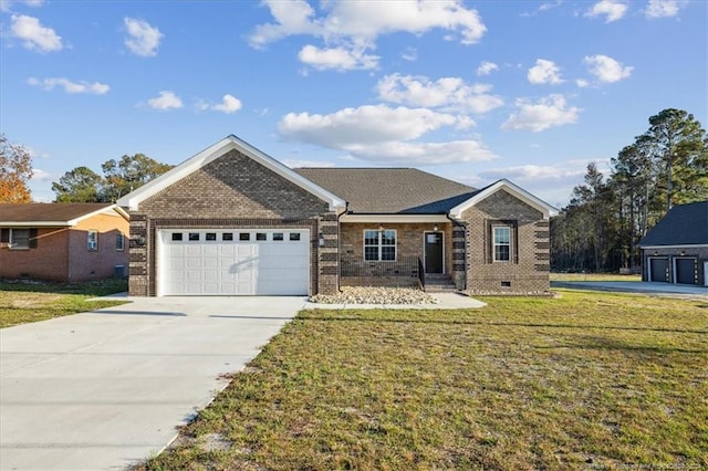 view of front of home with a garage and a front lawn