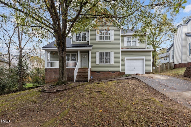 front of property with covered porch and a garage