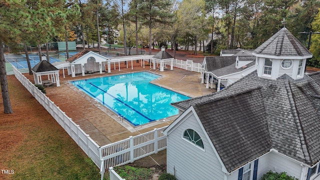 view of swimming pool with a patio area