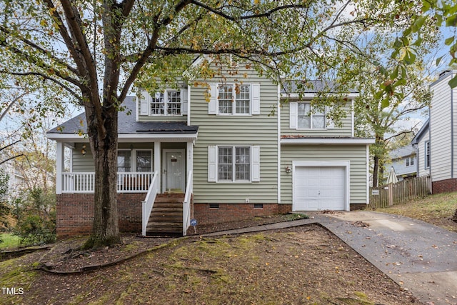 front facade featuring a porch and a garage