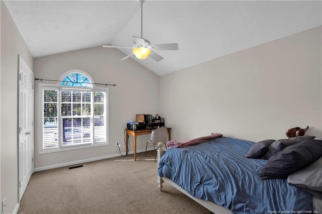 bedroom with carpet, lofted ceiling, multiple windows, and ceiling fan