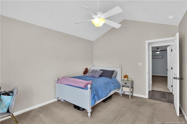 carpeted bedroom featuring ceiling fan and vaulted ceiling