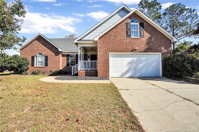 traditional-style house featuring brick siding, a garage, concrete driveway, and a front lawn