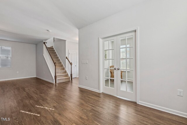 unfurnished room with dark hardwood / wood-style flooring and french doors