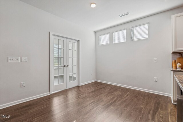 empty room featuring dark wood-type flooring