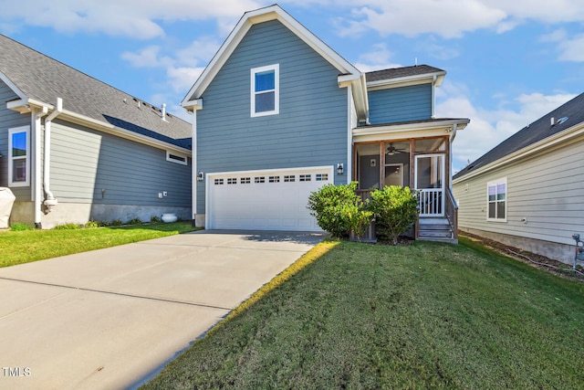 view of property with a sunroom, a garage, and a front yard