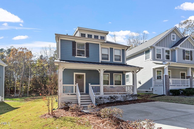 view of front of house featuring covered porch and a front lawn