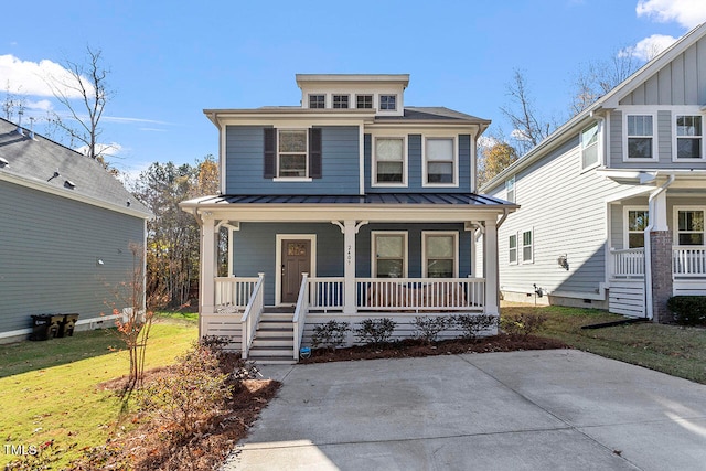 view of front of property featuring a front lawn and covered porch