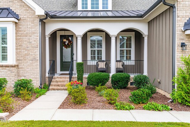 property entrance with covered porch