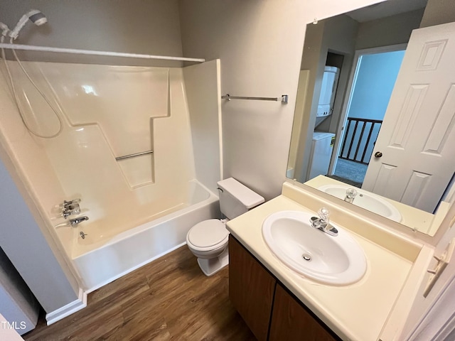 full bathroom featuring toilet, tub / shower combination, vanity, and hardwood / wood-style flooring