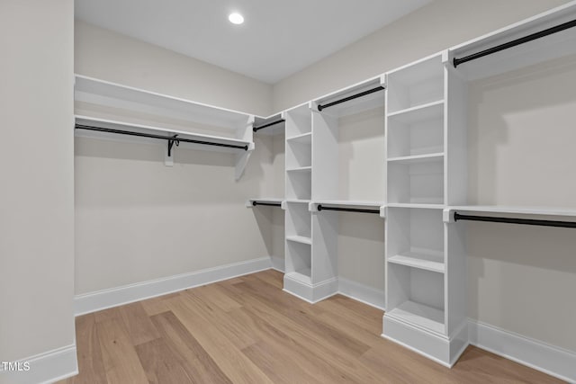 walk in closet featuring light hardwood / wood-style flooring