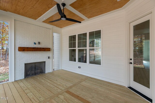 2105 Gentry Rd, Wake Forest, NC 27587 - wooden deck featuring a brick fireplace and a ceiling fan