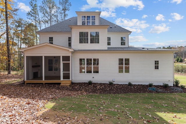 2105 Gentry Rd, Wake Forest, NC 27587 - rear view of property with a sunroom, roof with shingles, and a yard