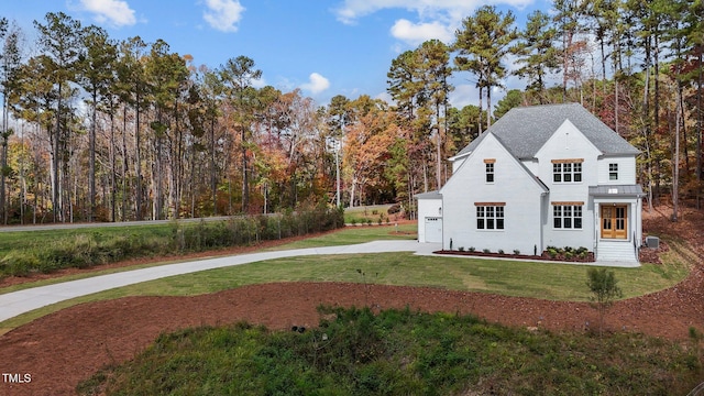 exterior space featuring central AC unit and a yard