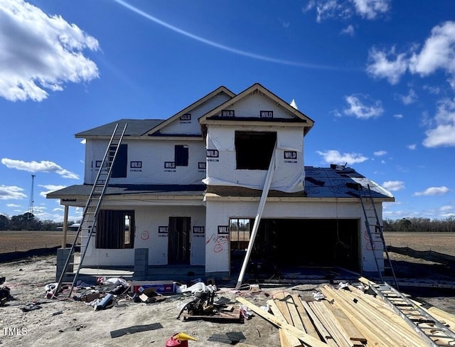 property under construction featuring covered porch and a garage