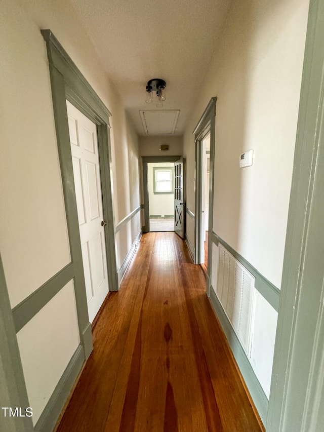 hallway with dark wood-type flooring