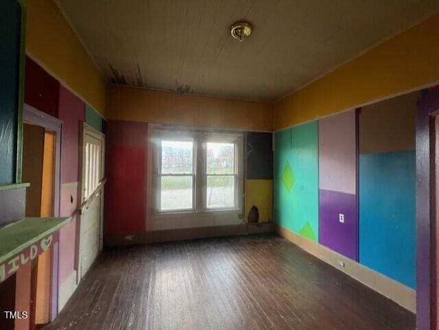 spare room featuring dark wood-type flooring