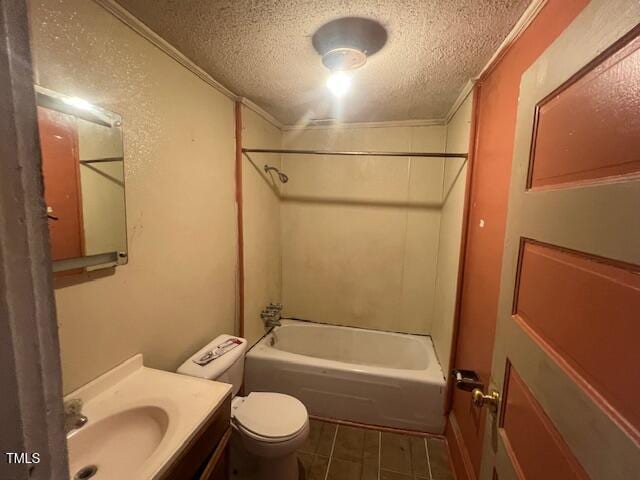 full bathroom featuring toilet, tile patterned flooring, washtub / shower combination, a textured ceiling, and vanity