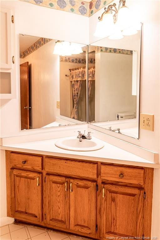 bathroom with tile patterned floors and vanity