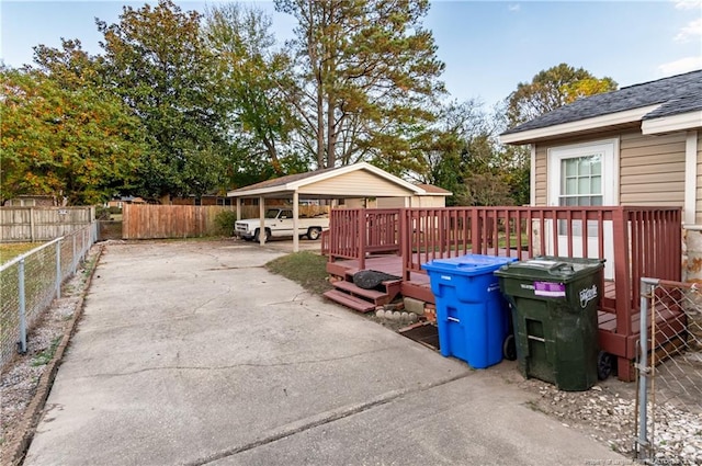 view of patio / terrace featuring a deck and a carport