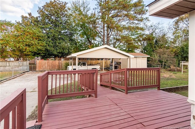 wooden deck with an outbuilding