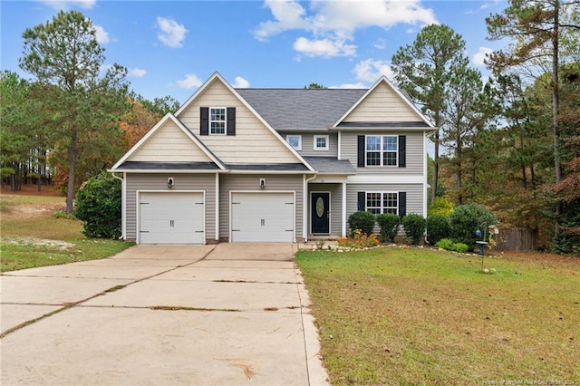 view of front of house with a garage and a front yard