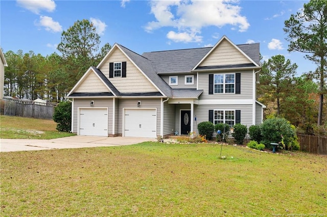 view of front of house featuring a garage and a front yard