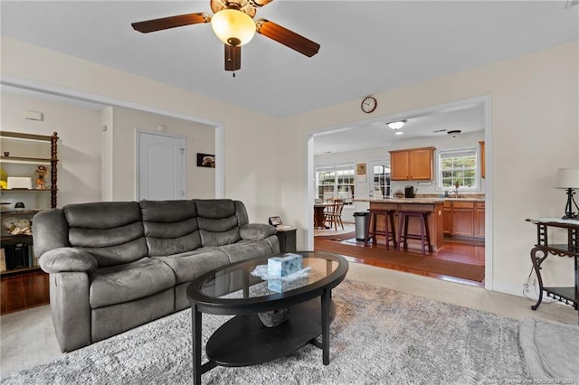 living room featuring ceiling fan