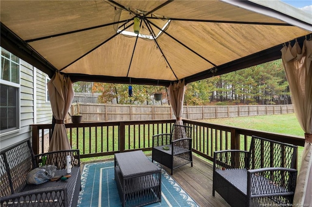 deck with a lawn, a gazebo, and an outdoor living space