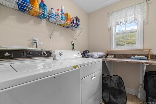 laundry area with independent washer and dryer