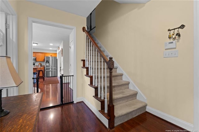 stairway with wood-type flooring