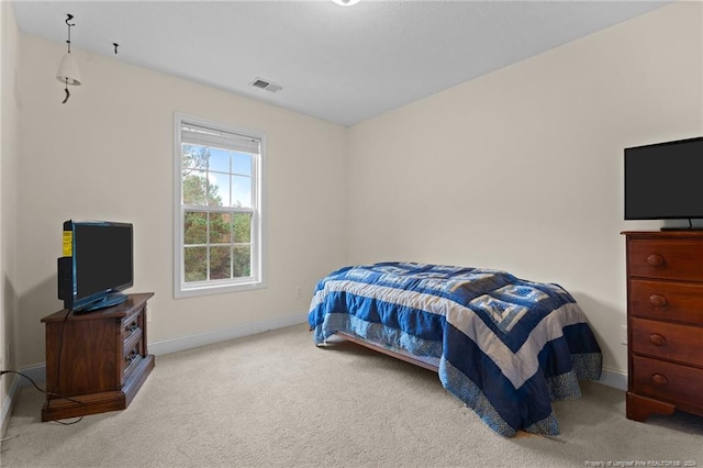 bedroom with light carpet