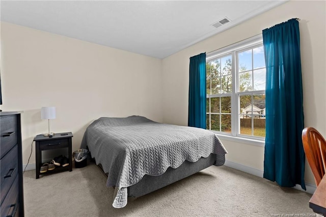 bedroom with light colored carpet