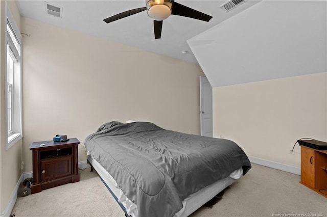 bedroom featuring light carpet, ceiling fan, and vaulted ceiling