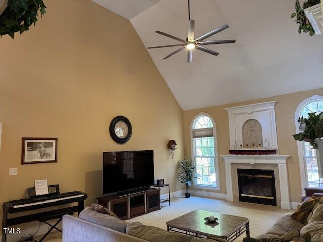 living room with high vaulted ceiling, a wealth of natural light, and ceiling fan