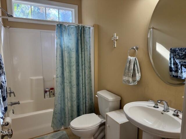 full bathroom with toilet, sink, and shower / bathtub combination with curtain