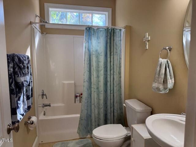 2012 Silverleaf Dr, Youngsville, NC 27596 - full bathroom featuring a sink, shower / bath combo with shower curtain, and toilet