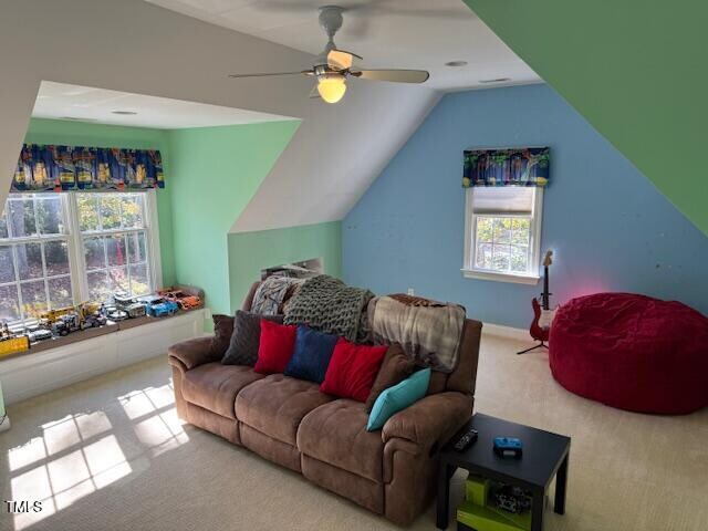 carpeted living room featuring lofted ceiling and ceiling fan