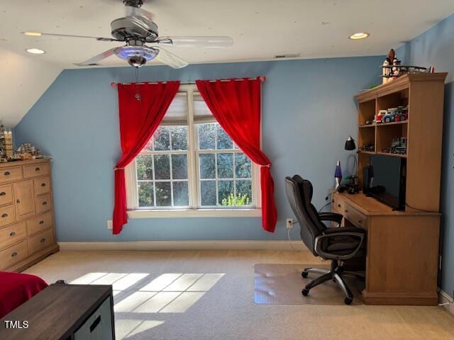 carpeted office space with ceiling fan and vaulted ceiling