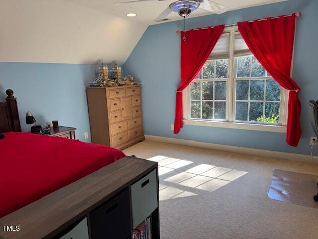 carpeted bedroom with lofted ceiling and ceiling fan